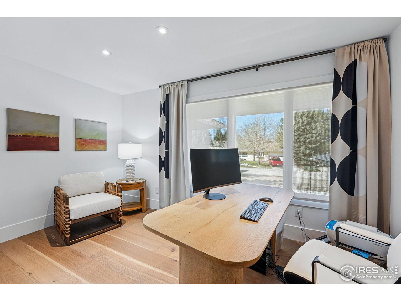 6923 Hunter Place Boulder, CO 80301 - Photo 23 of 34 a bedroom with furniture and a flat screen tv