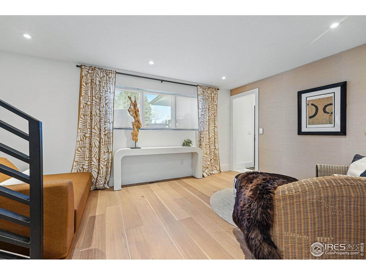 6923 Hunter Place Boulder, CO 80301 - Photo 24 of 34 a bedroom with a bed and a painting on the wall