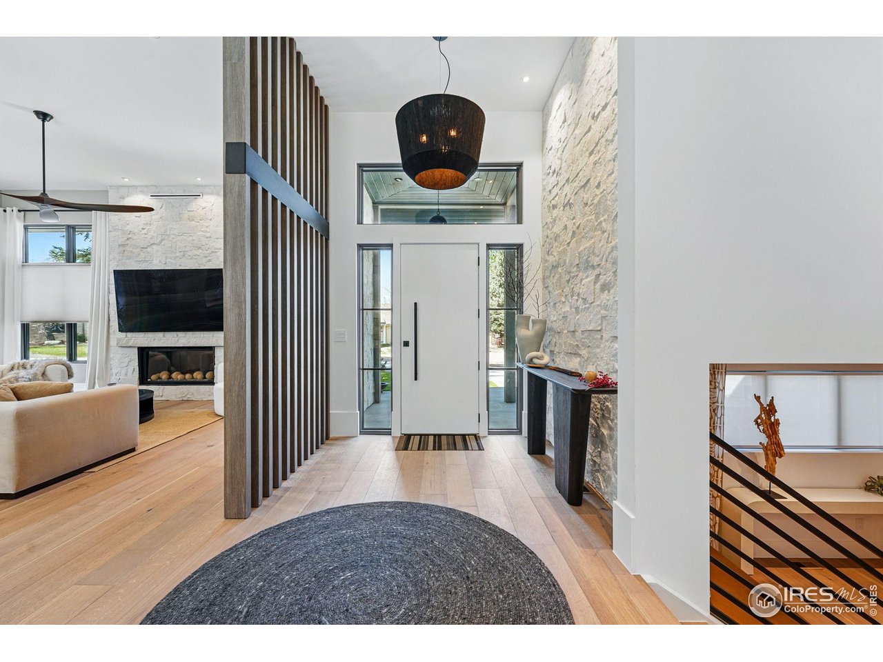 6923 Hunter Place Boulder, CO 80301 - Photo 6 of 34 a living room with furniture and a wooden floor