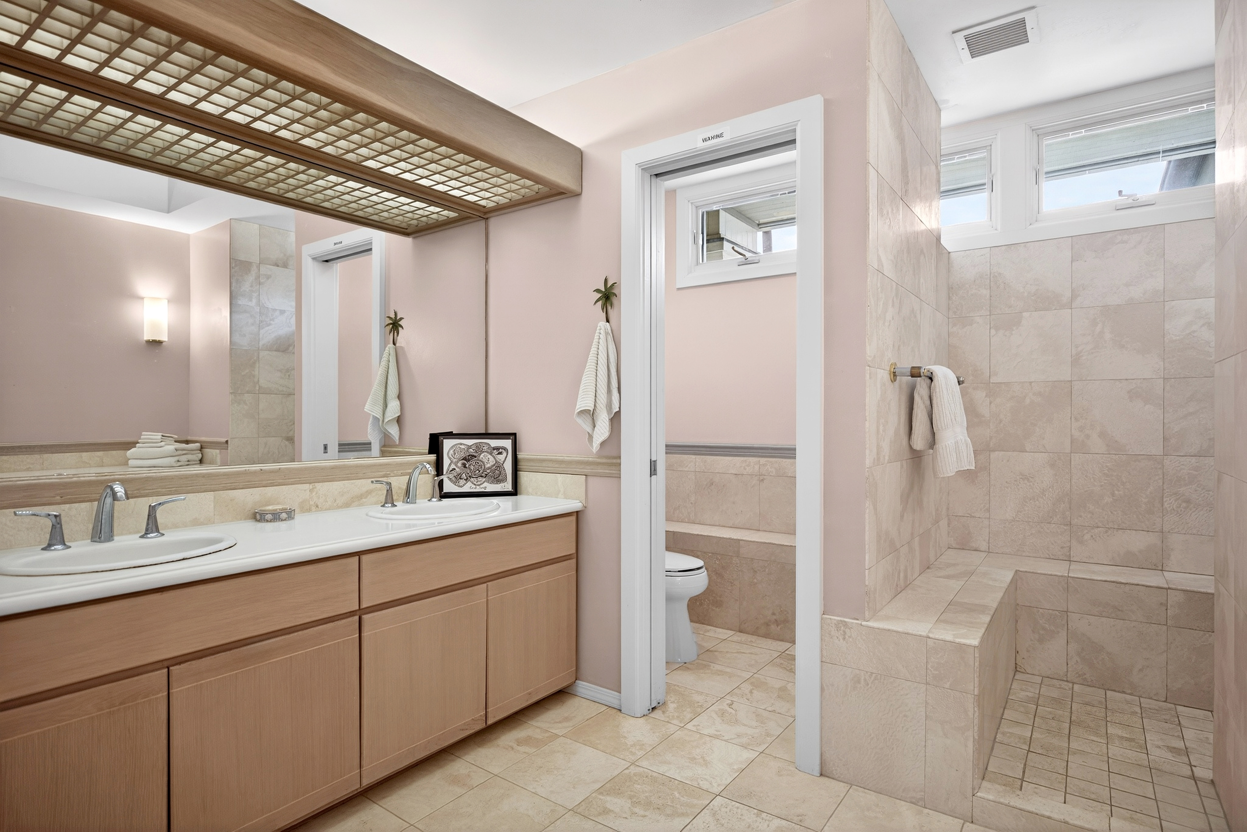 68-1375 Pauoa Road, Unit Q2 Kamuela, HI 96743 - Photo 17 of 30 a bathroom with a double vanity sink a toilet and shower