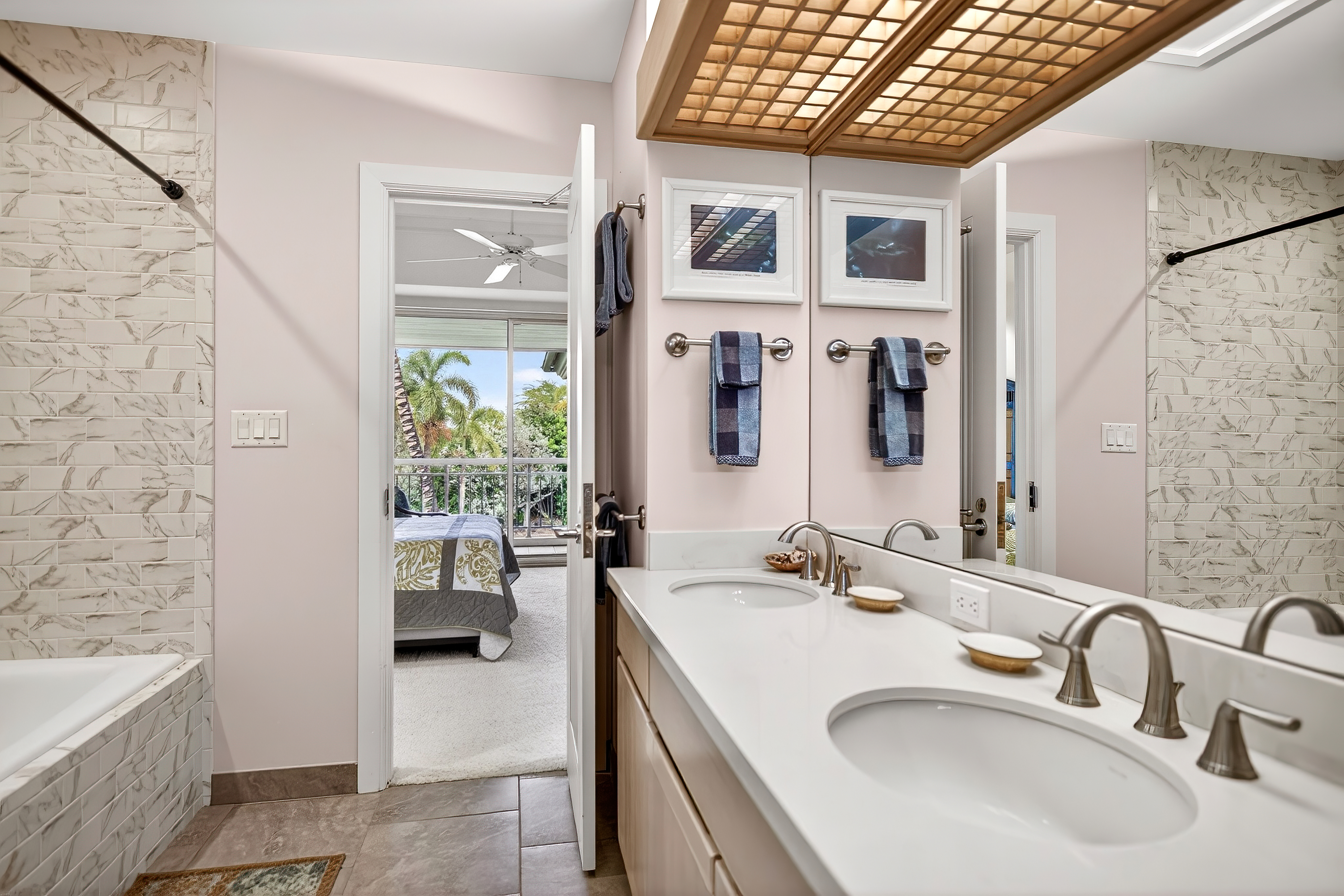 68-1375 Pauoa Road, Unit Q2 Kamuela, HI 96743 - Photo 23 of 30 a en suite bathroom with a sink a large mirror and a bathtub