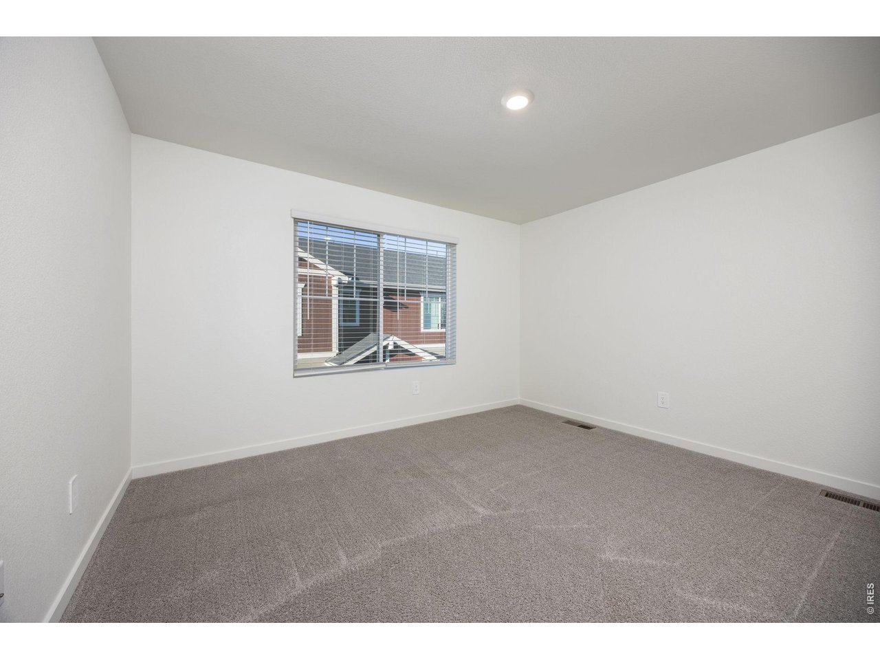 315 Condor Way Johnstown, CO 80534 - Photo 13 of 25 a view of an empty room with a window