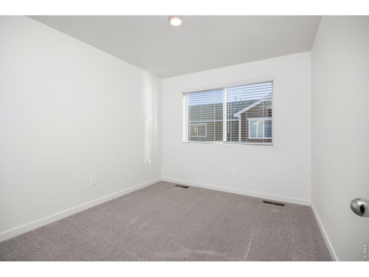 315 Condor Way Johnstown, CO 80534 - Photo 20 of 25 an empty room with a window