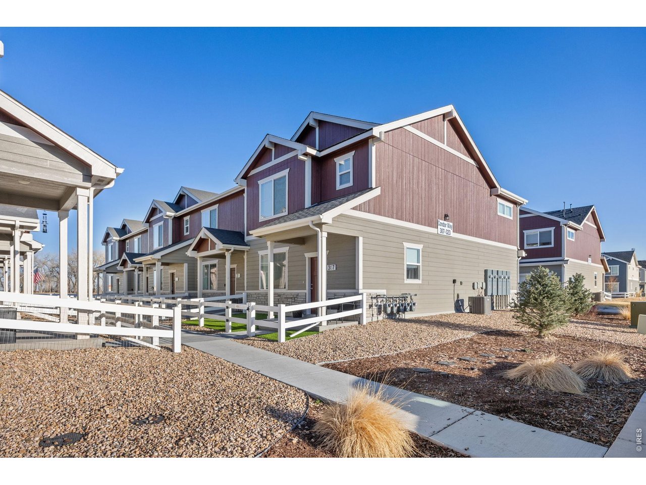 315 Condor Way Johnstown, CO 80534 - Photo 2 of 25 a front view of a house with a yard