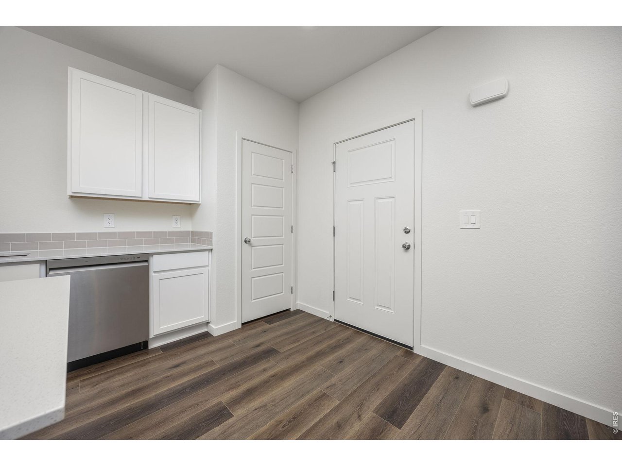 315 Condor Way Johnstown, CO 80534 - Photo 5 of 25 a view of an empty room with wooden floor