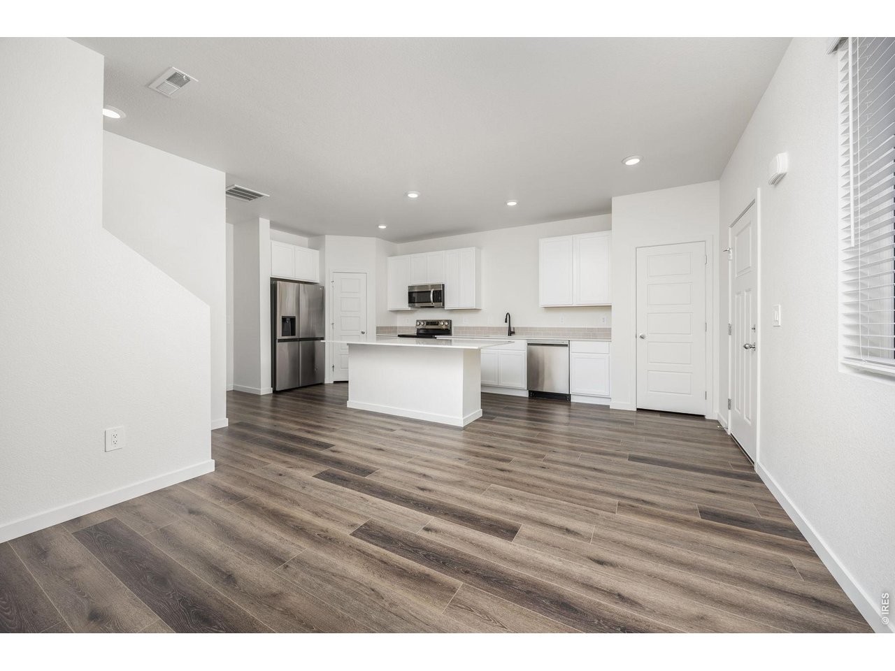 315 Condor Way Johnstown, CO 80534 - Photo 7 of 25 a view of kitchen view and wooden floor