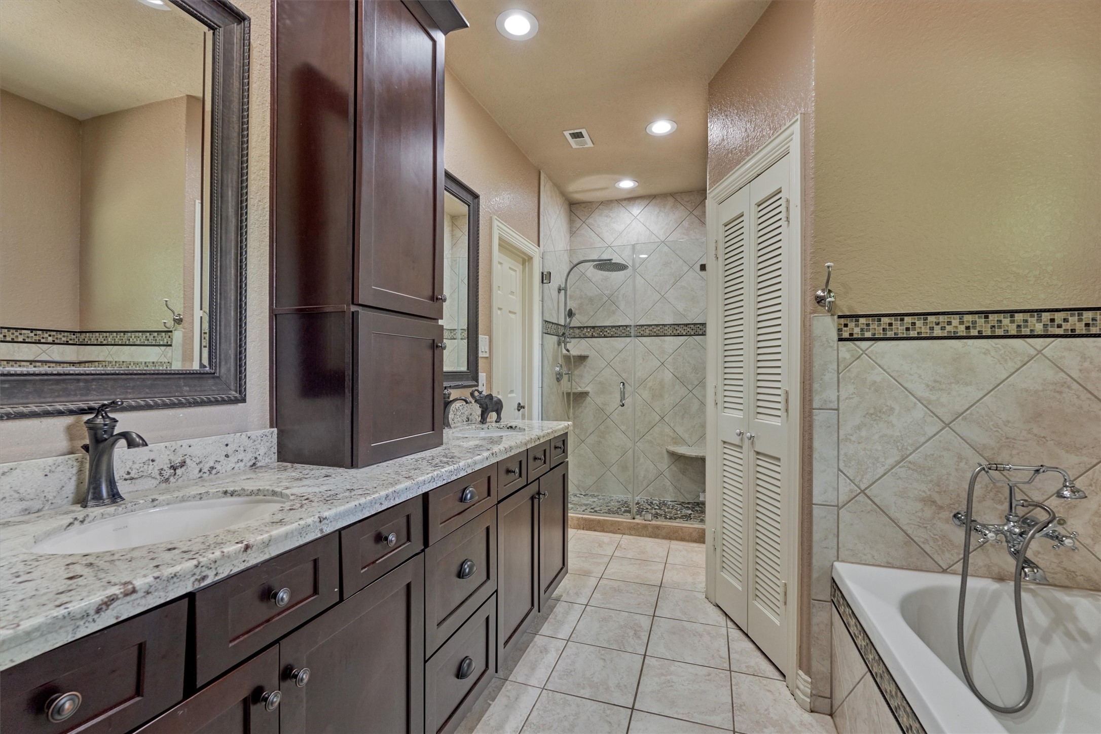 420 Ruel Lane Magnolia, TX 77355 - Photo 22 of 47 Shared bathroom for Bedrooms #2 and #3 complete with separate tub and shower, double sinks and linen closet.