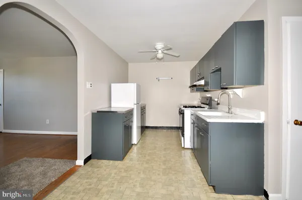 a view of a kitchen with a sink