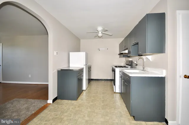 a view of a kitchen with a sink