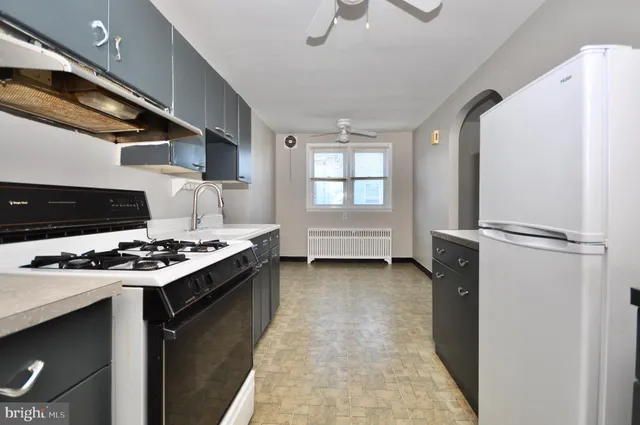 a kitchen with a stove and a refrigerator