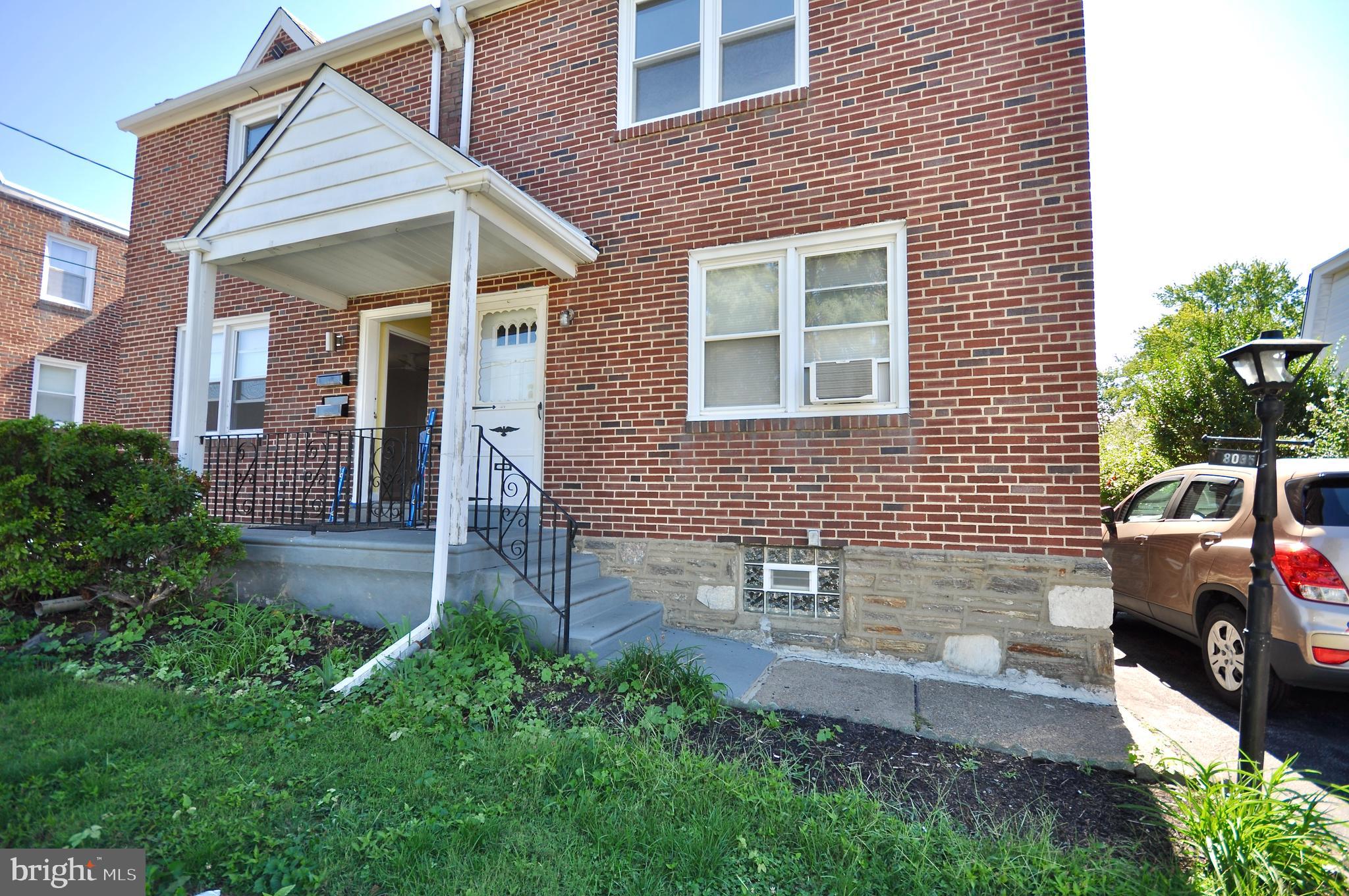 8035 Pine Road Philadelphia, PA 19111 - Photo 2 of 23 a front view of a house with a yard and garage