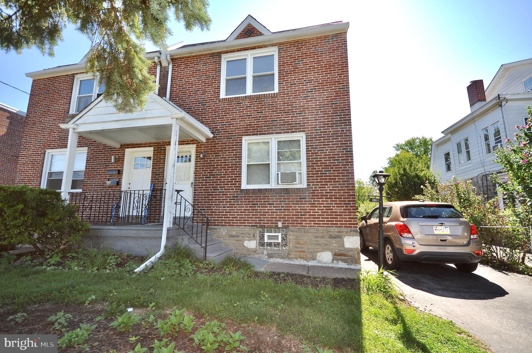 8035 Pine Road Philadelphia, PA 19111 - Photo 21 of 23 a couple of cars parked in front of a brick house