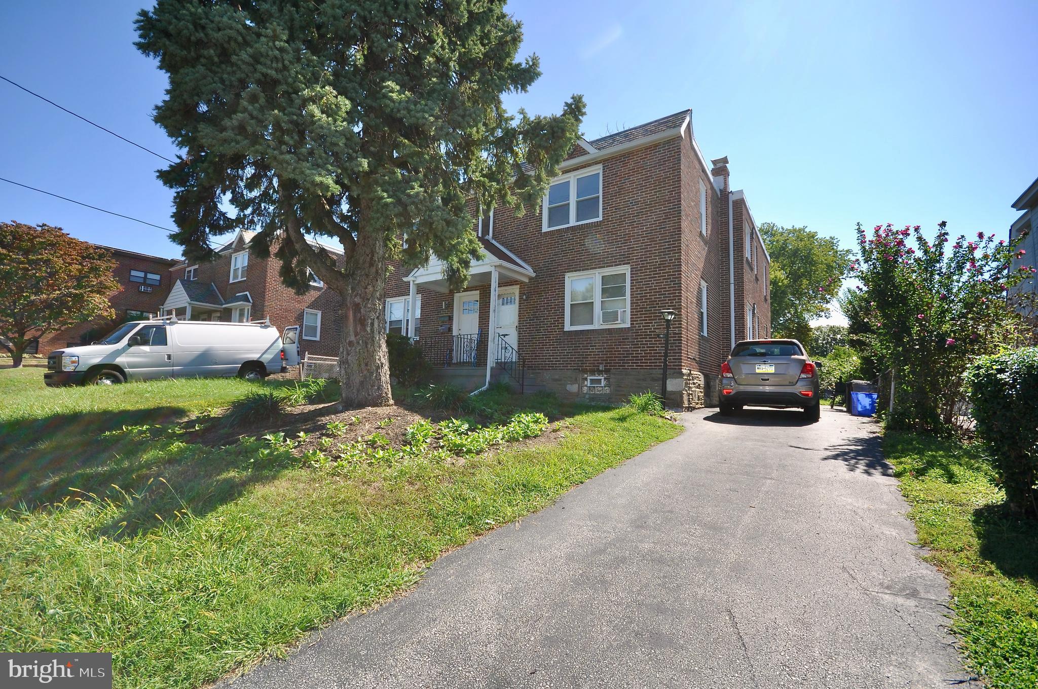 8035 Pine Road Philadelphia, PA 19111 - Photo 23 of 23 a front view of a house with a yard and garage