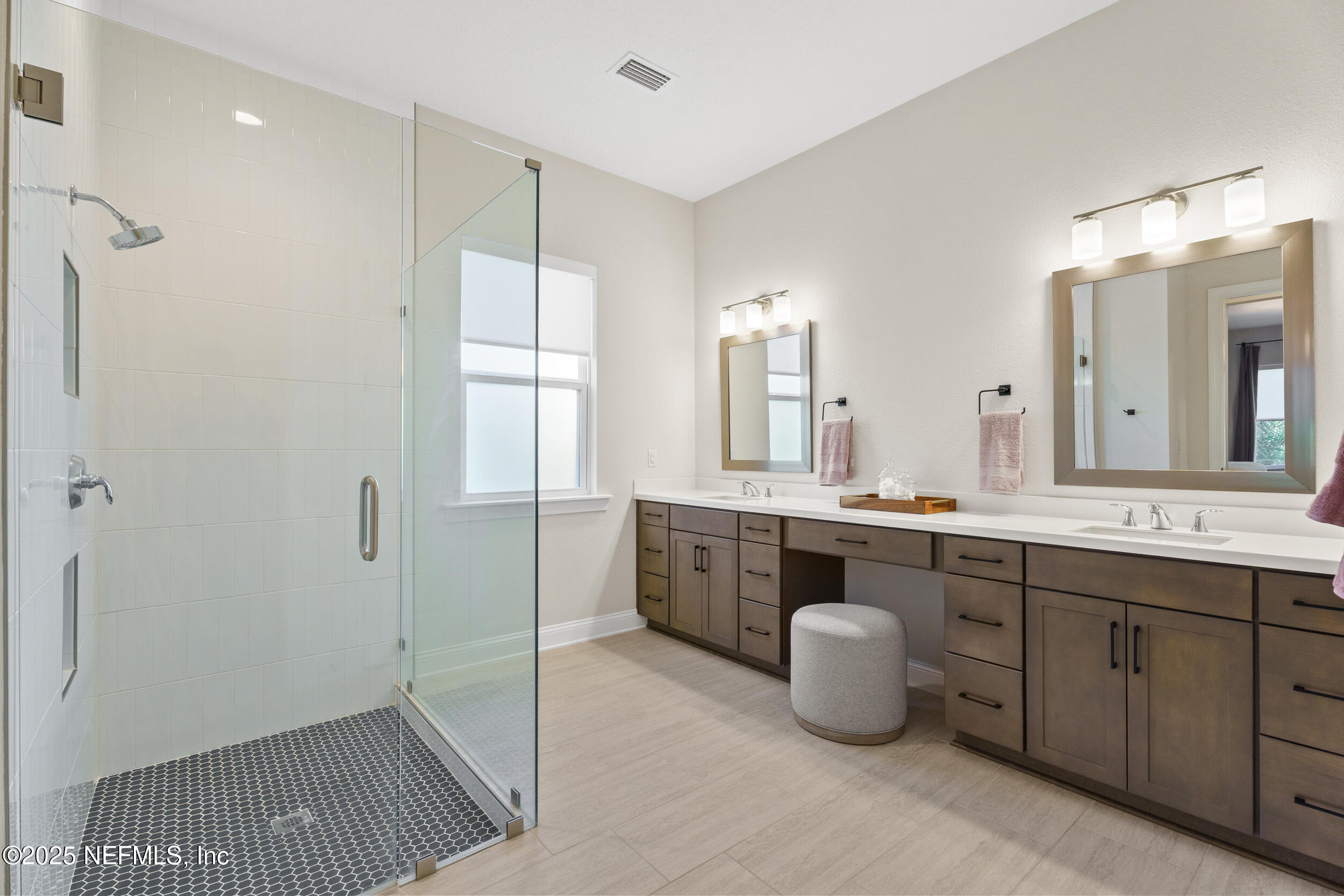 160 Hickory Ranch Drive St. Johns, FL 32259 - Photo 20 of 42 a spacious bathroom with a double vanity sink a mirror and a bathtub
