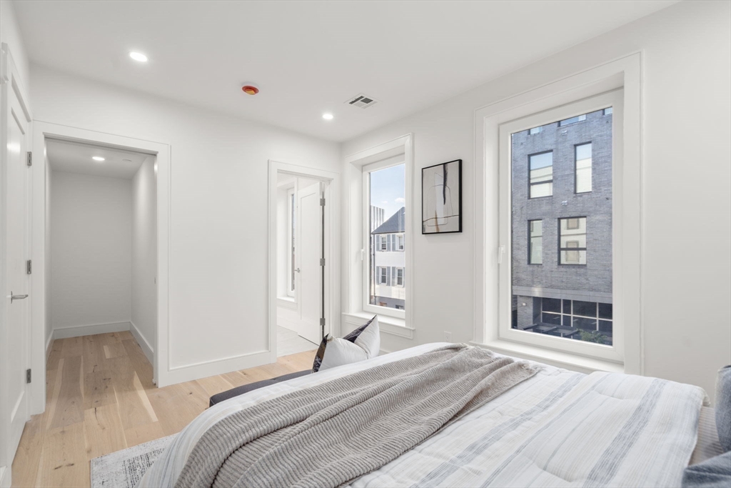 90 A Street, Unit 3 Boston, MA 02127 - Photo 15 of 20 a bedroom with a bed and a window