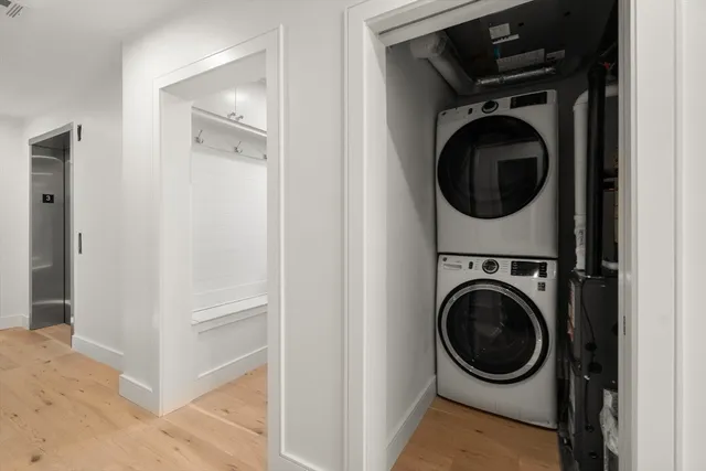 a view of a hallway with washer and dryer