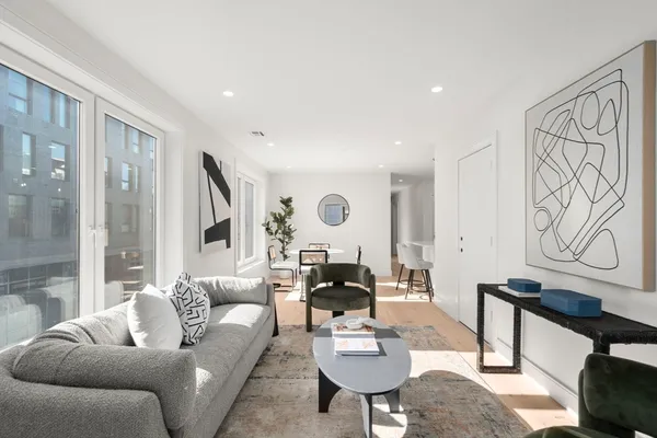 a living room with furniture and a table