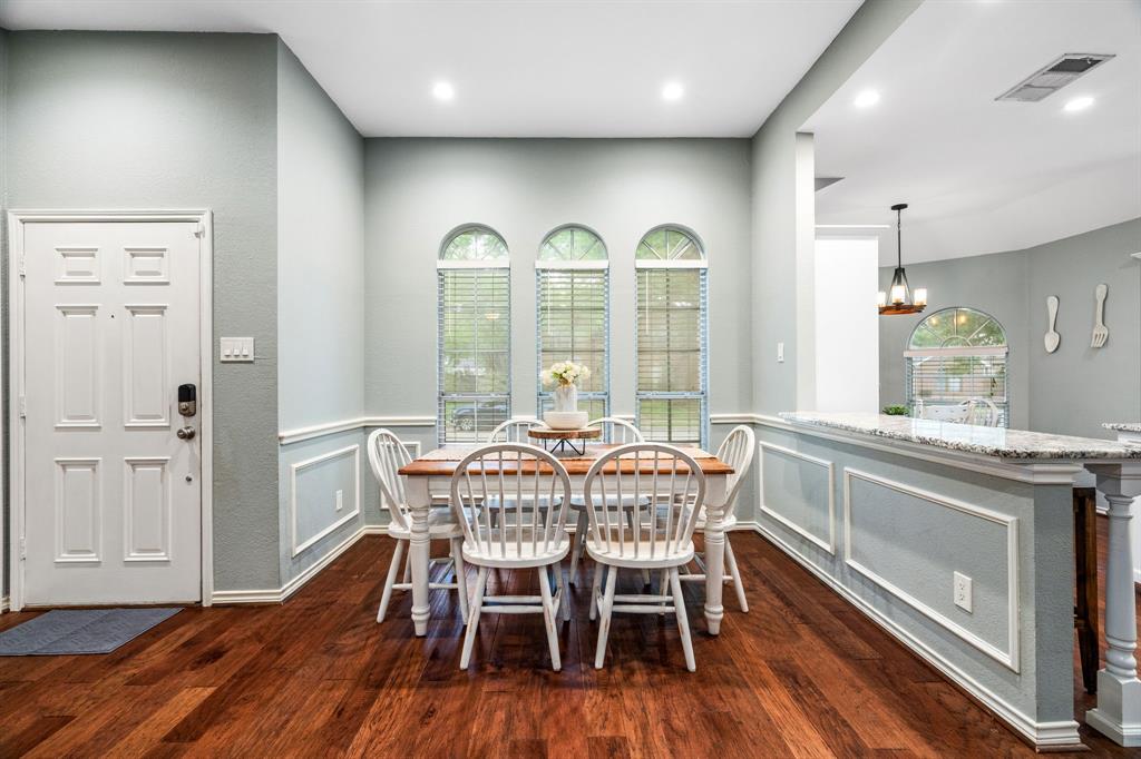 2302 Randi Road Rowlett, TX 75088 - Photo 6 of 33 a view of a dining room with furniture window and wooden floor