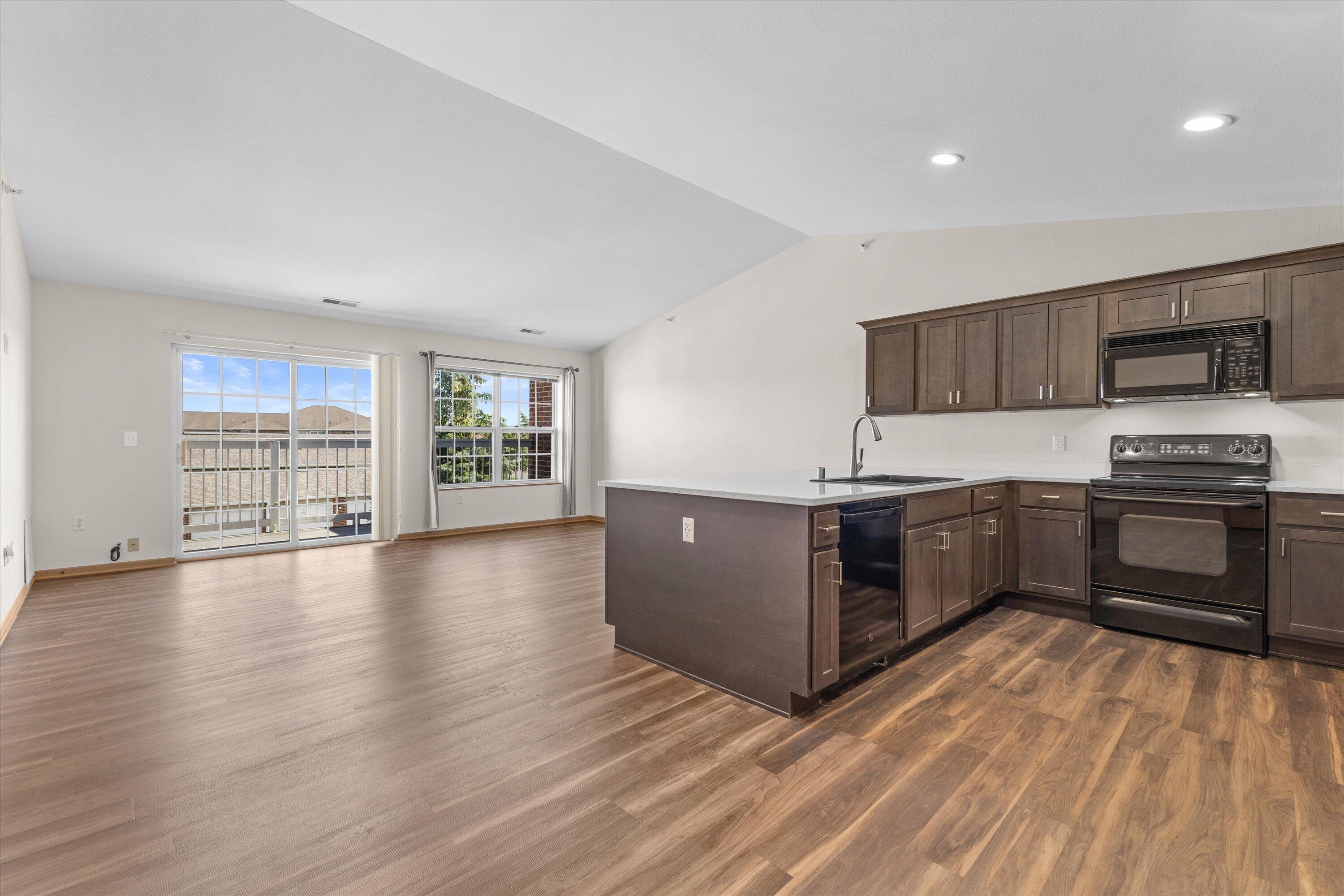 6746 100th Place, Unit E Pleasant Prairie, WI 53158 - Photo 7 of 21 Kitchen facing living Area