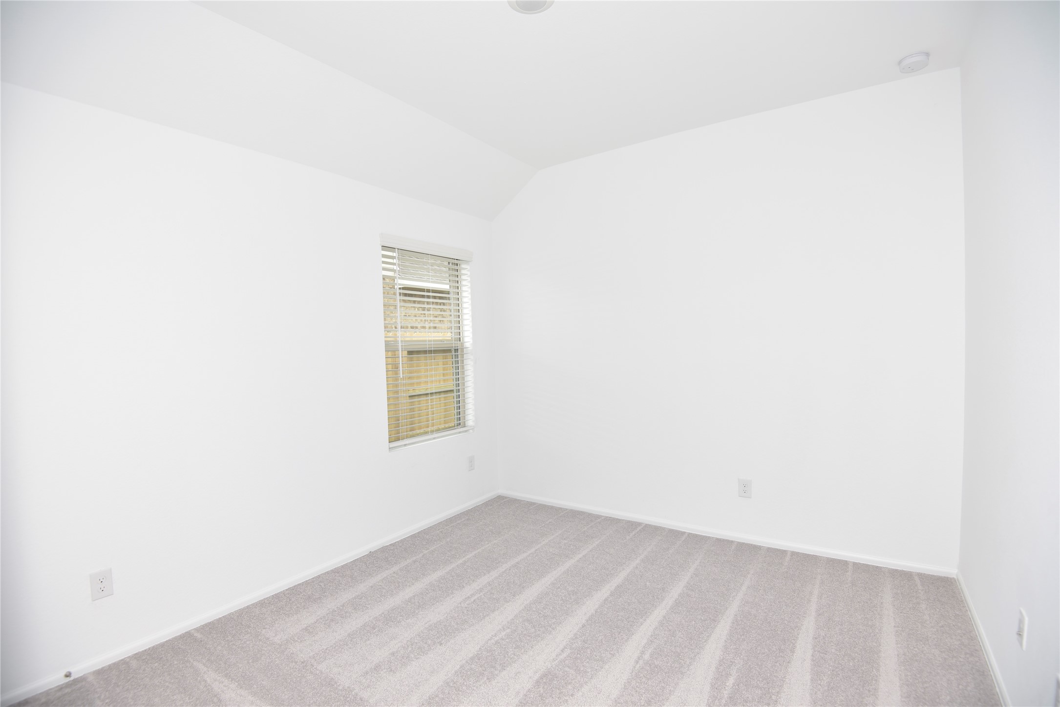 21562 Casavatore Drive New Caney, TX 77357 - Photo 14 of 24 a view of an empty room with a window