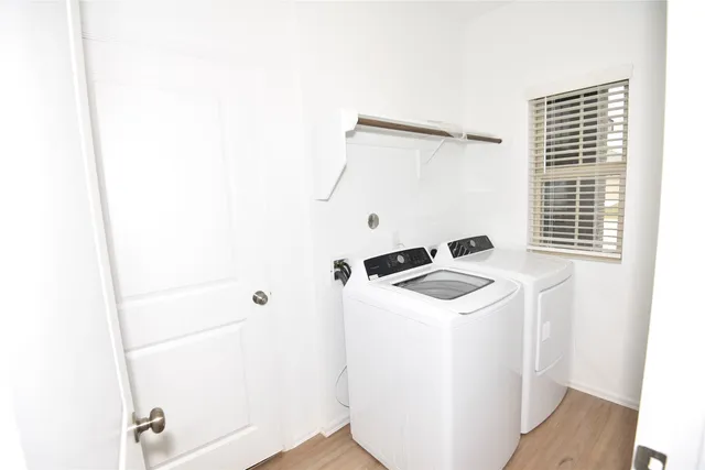 a utility room with dryer and washer