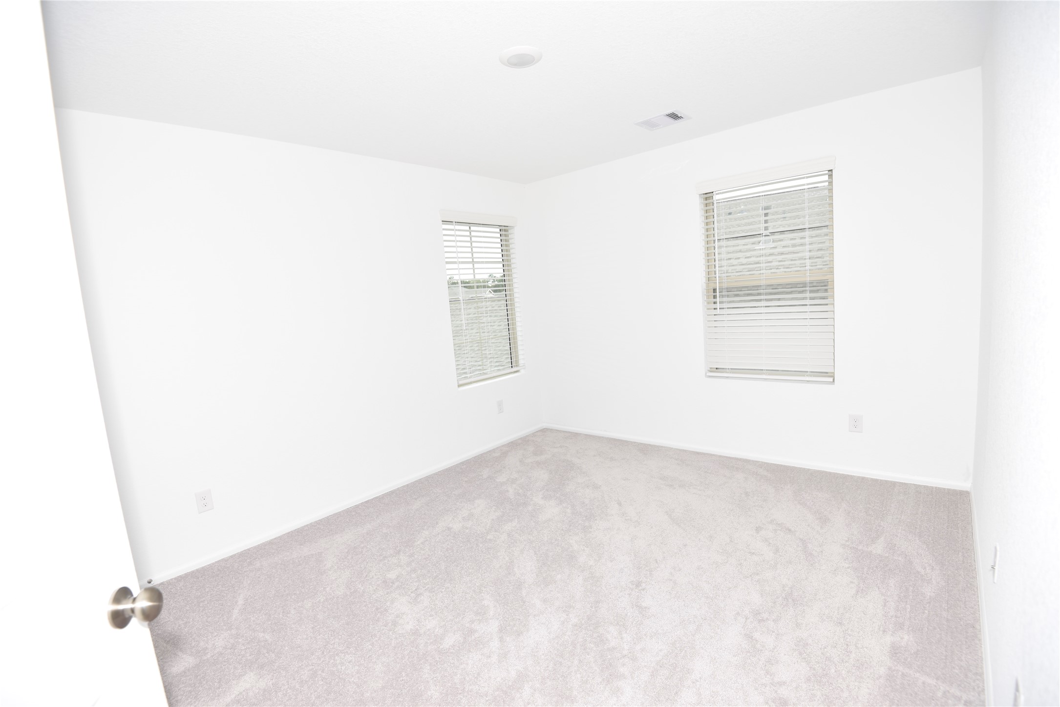 21562 Casavatore Drive New Caney, TX 77357 - Photo 18 of 24 an empty room with windows