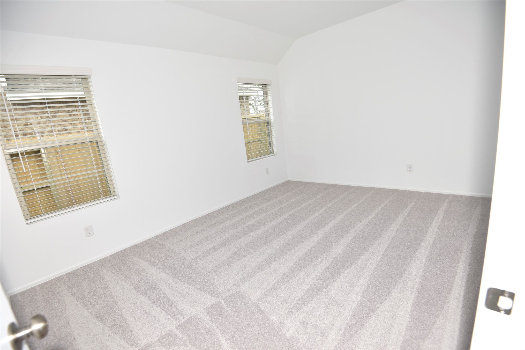21562 Casavatore Drive New Caney, TX 77357 - Photo 10 of 24 a view of an empty room with windows