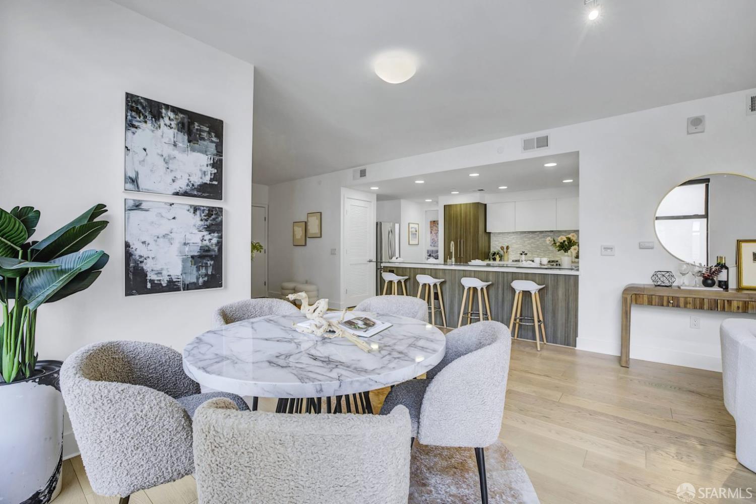 1080 Sutter Street, Unit 702 San Francisco, CA 94109 - Photo 13 of 27 a dining room with furniture and window