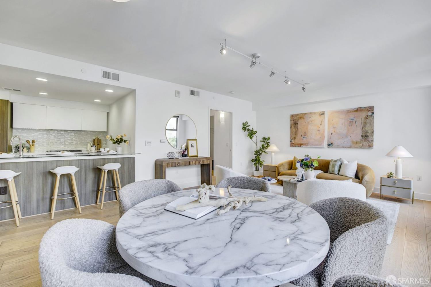 1080 Sutter Street, Unit 702 San Francisco, CA 94109 - Photo 14 of 27 a living room with furniture a dining table and kitchen view