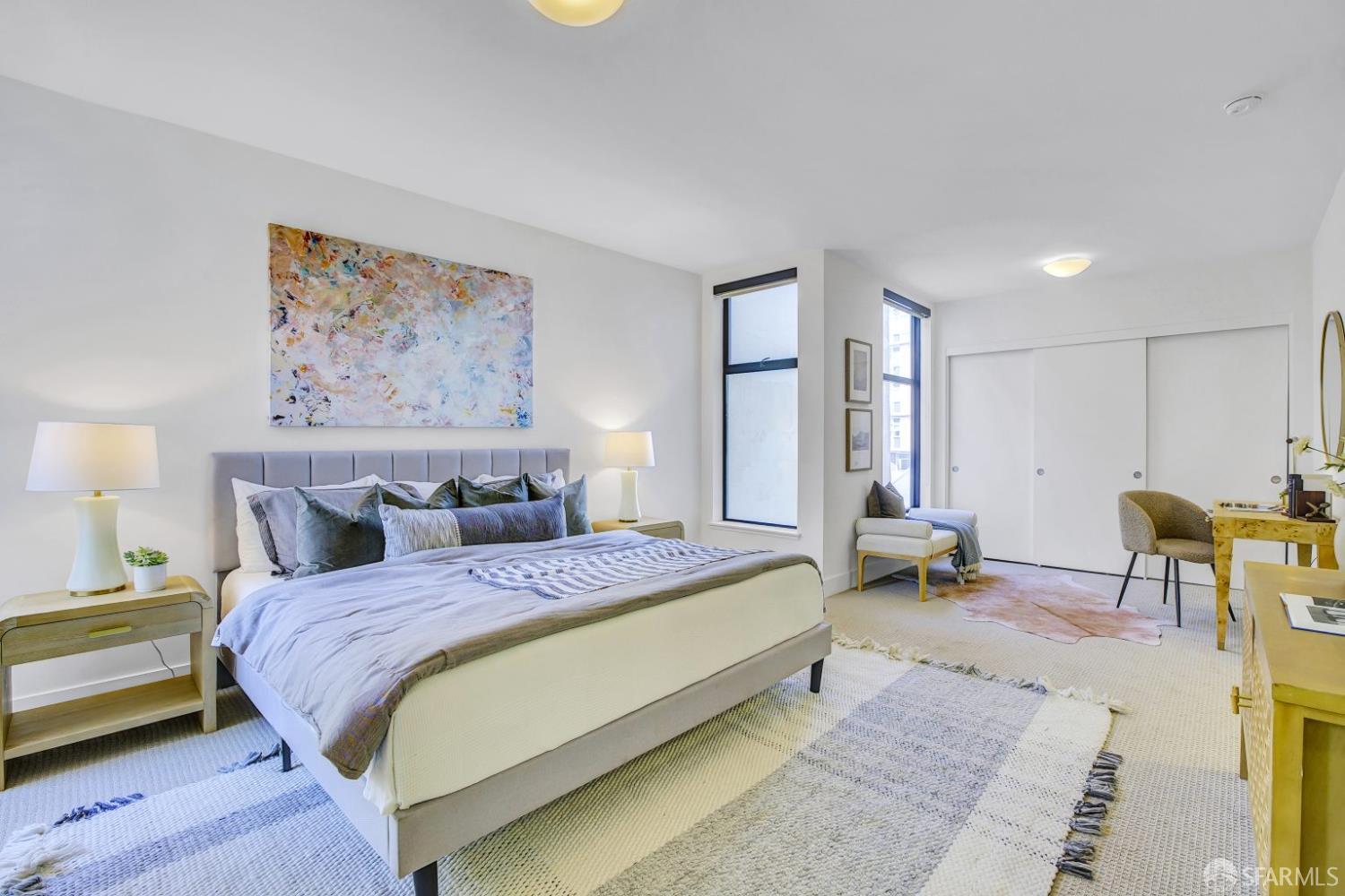 1080 Sutter Street, Unit 702 San Francisco, CA 94109 - Photo 16 of 27 a spacious bedroom with a bed a table and chair