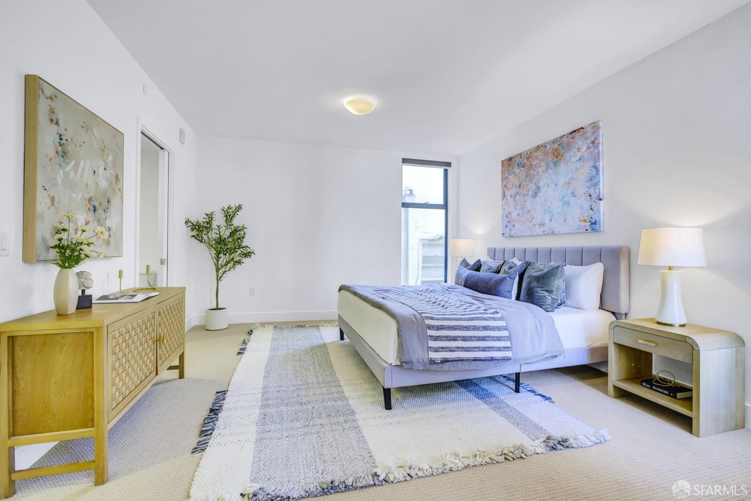 1080 Sutter Street, Unit 702 San Francisco, CA 94109 - Photo 17 of 27 a bedroom with a bed and a couch