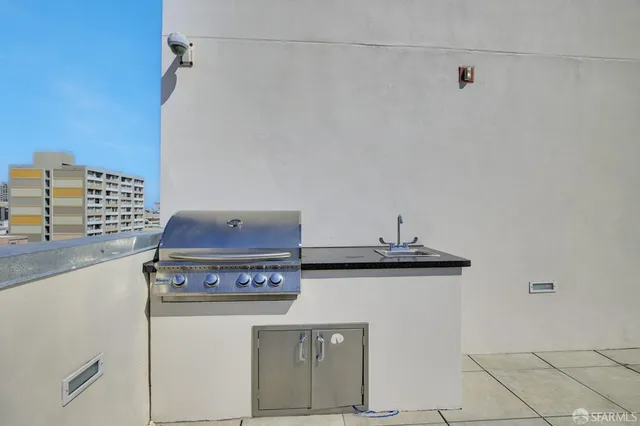 a view of a kitchen with stove and cabinets