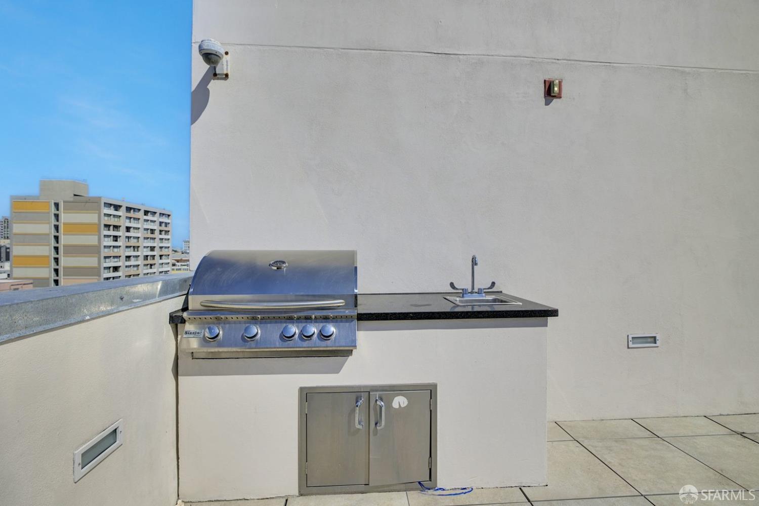 1080 Sutter Street, Unit 702 San Francisco, CA 94109 - Photo 22 of 27 a view of a kitchen with stove and cabinets