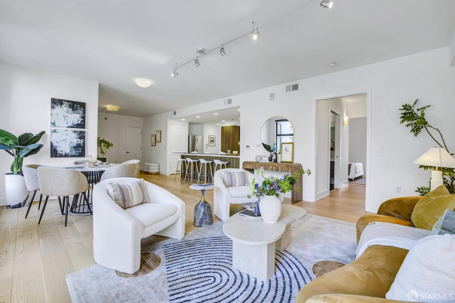 1080 Sutter Street, Unit 702 San Francisco, CA 94109 - Photo 3 of 27 a living room with furniture and wooden floor