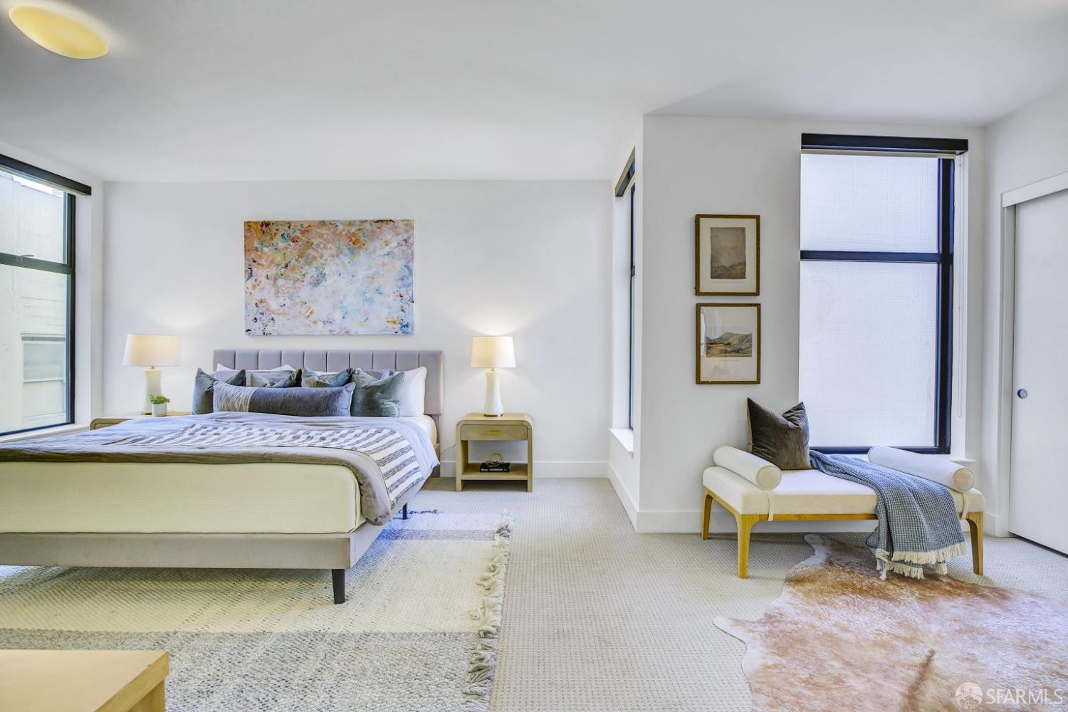 1080 Sutter Street, Unit 702 San Francisco, CA 94109 - Photo 5 of 27 a bedroom with a bed and a couch