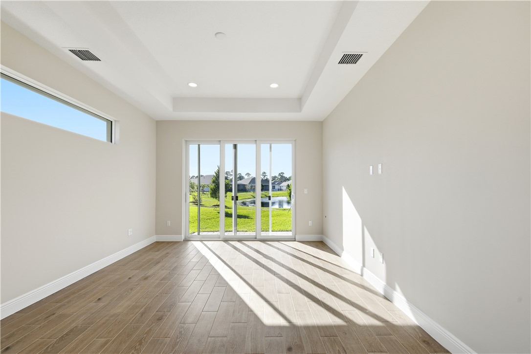 6304 High Pointe Circle Vero Beach, FL 32967 - Photo 11 of 25 a view of an empty room with a window