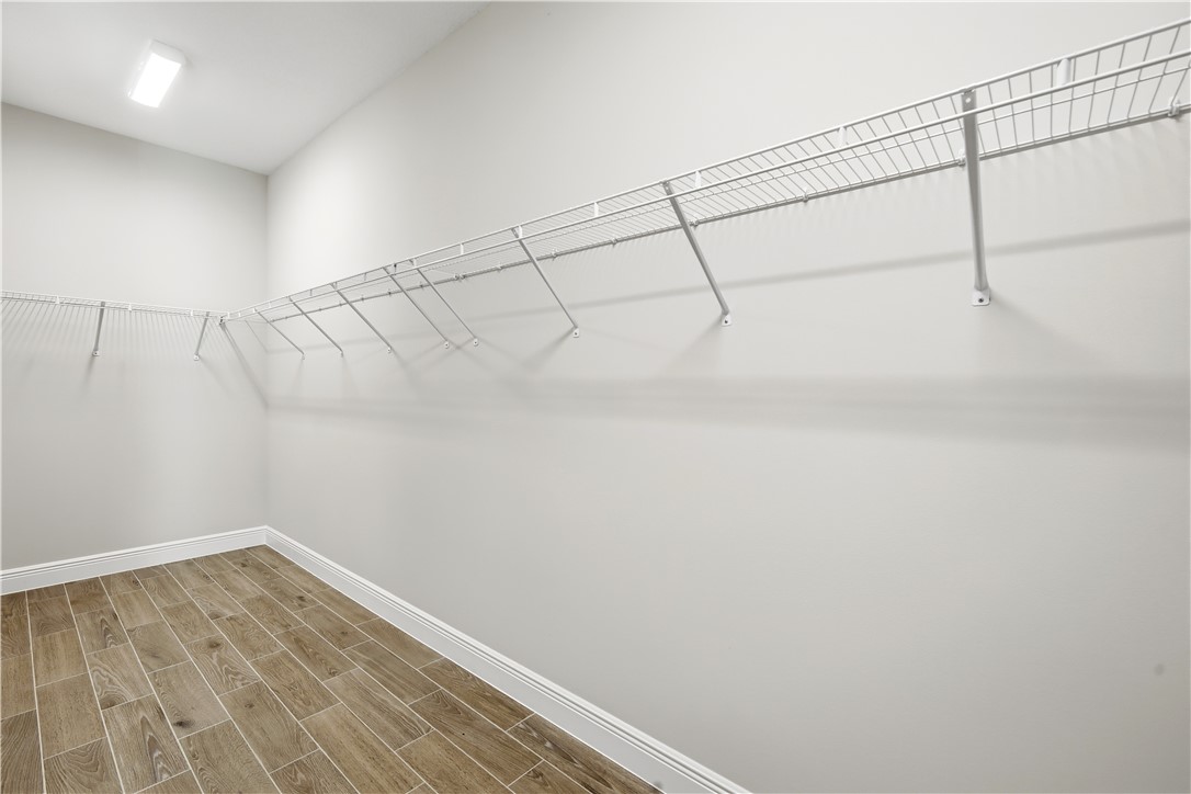 6304 High Pointe Circle Vero Beach, FL 32967 - Photo 13 of 25 a view of a room with racks on the wall