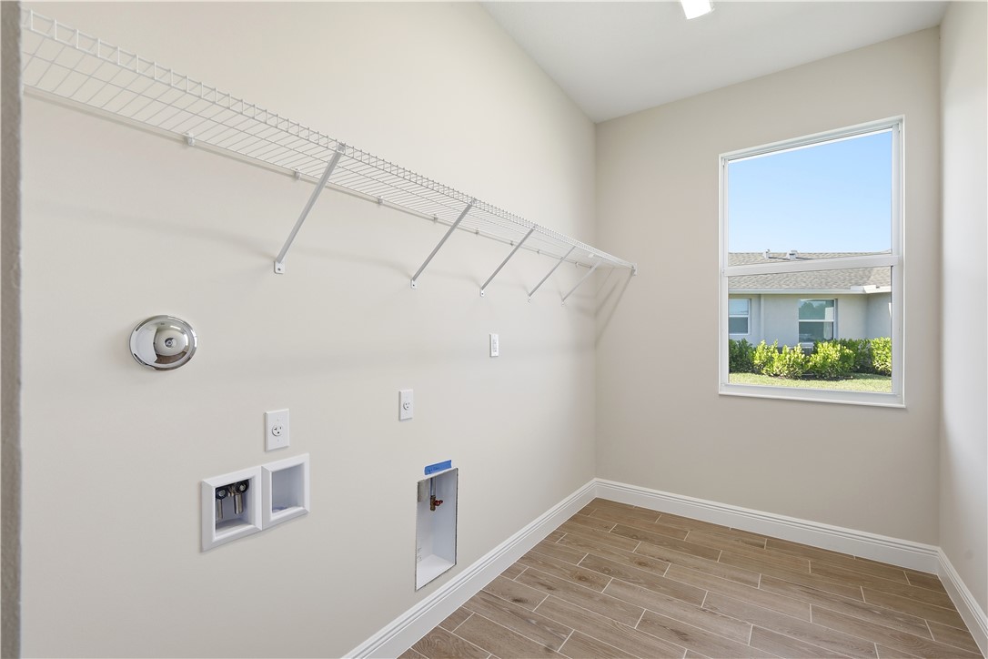 6304 High Pointe Circle Vero Beach, FL 32967 - Photo 19 of 25 a view of room with window and wooden floor