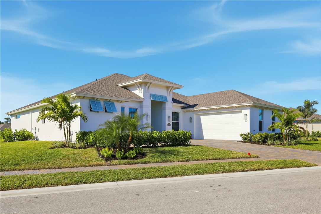 6304 High Pointe Circle Vero Beach, FL 32967 - Photo 25 of 25 a front view of house with yard and green space