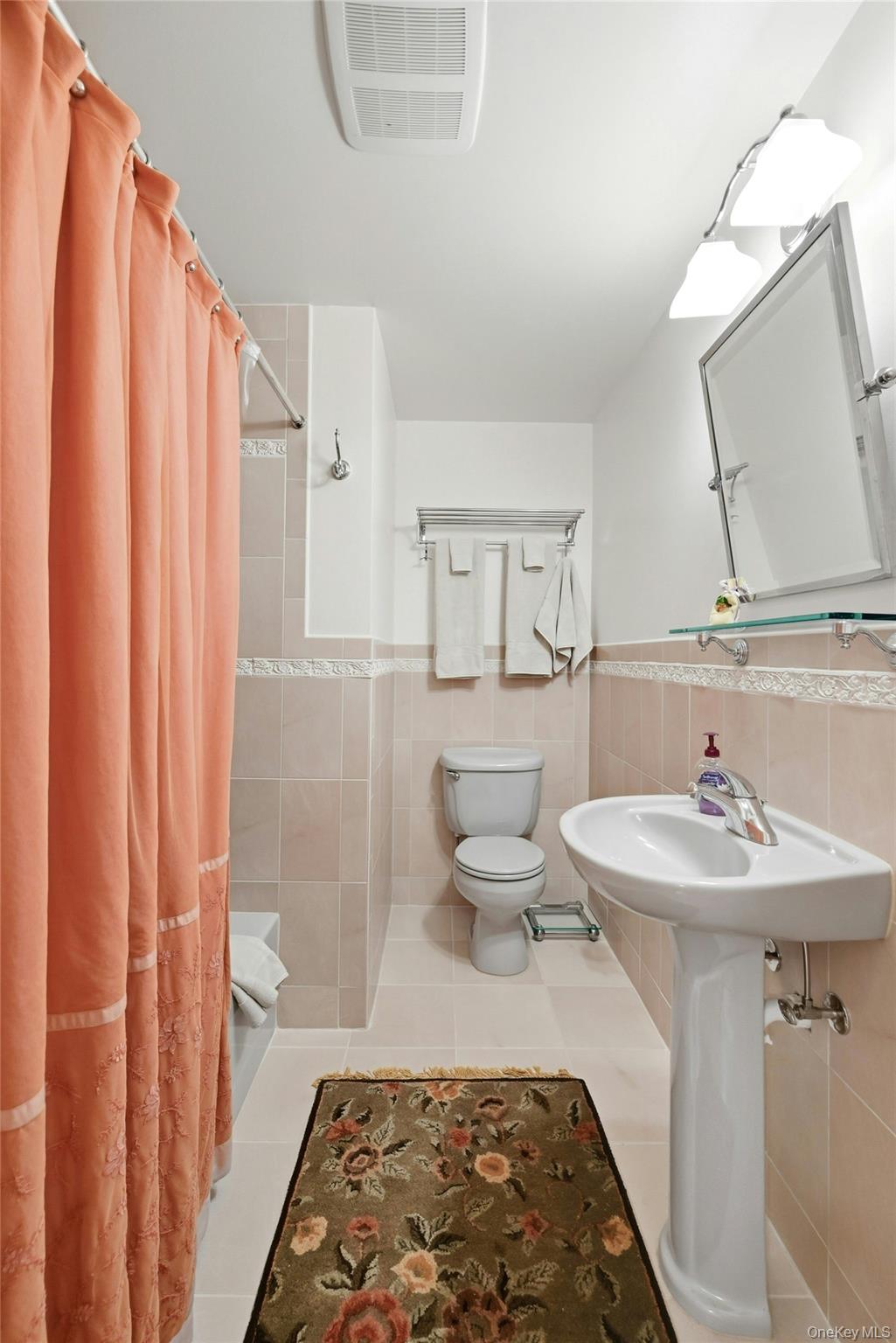 6 Thunder Road Miller Place, NY 11764 - Photo 37 of 50 The Lower Level Also Offers A Beautiful Full Bathroom With Ceramic Tiled Walls, Decorative Inlays/Borders, Full Bathtub With All Fully Floor To Ceiling Ceramic Tiled Walls, Pedestal Sink, Ceramic Tiled Floor, Pocket Door & Upgraded Fixtures.
