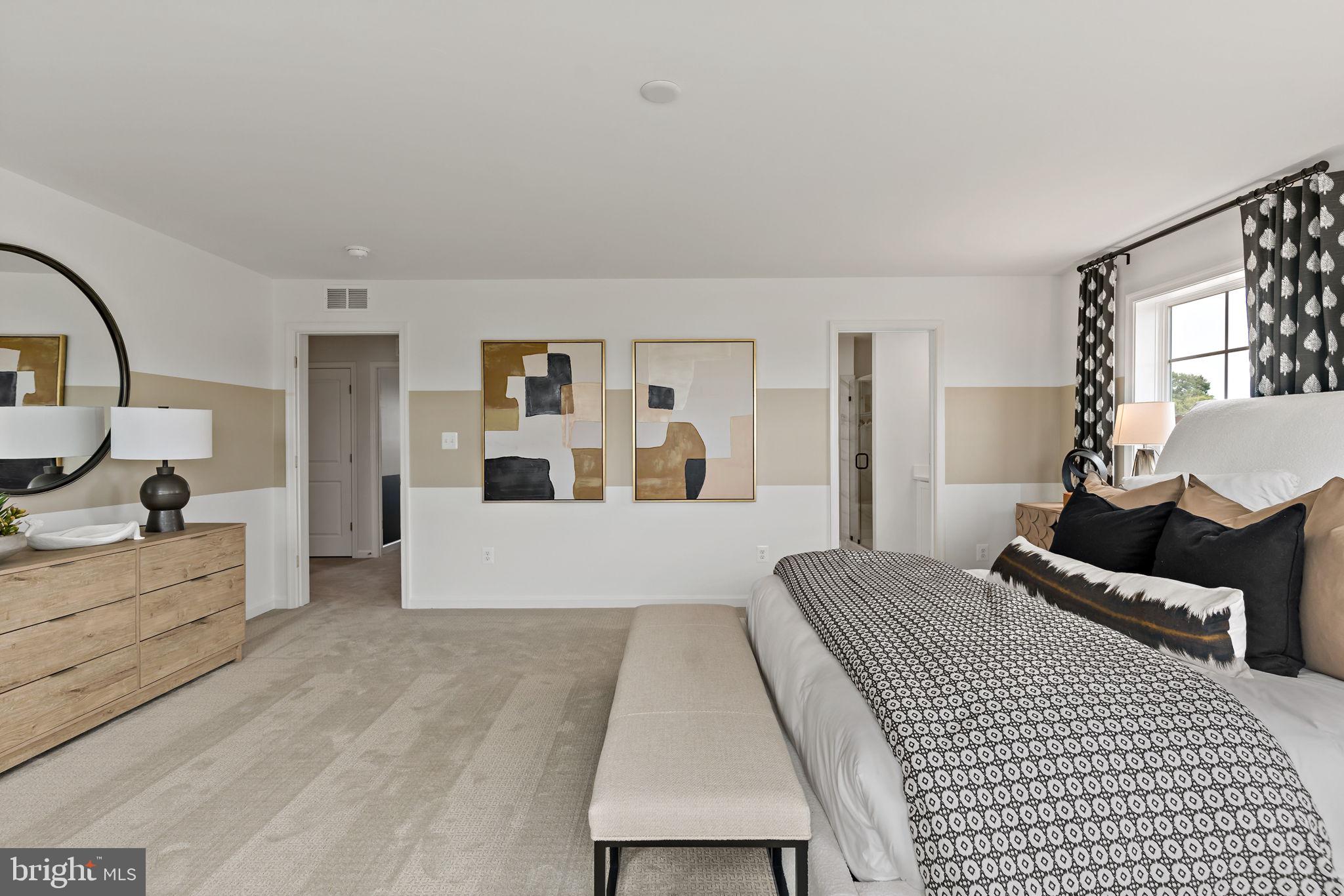 Tbb Tbb Outrigger Road, Unit CARNEGIE Inwood, WV 25428 - Photo 17 of 60 a bedroom with a large bed and a couch