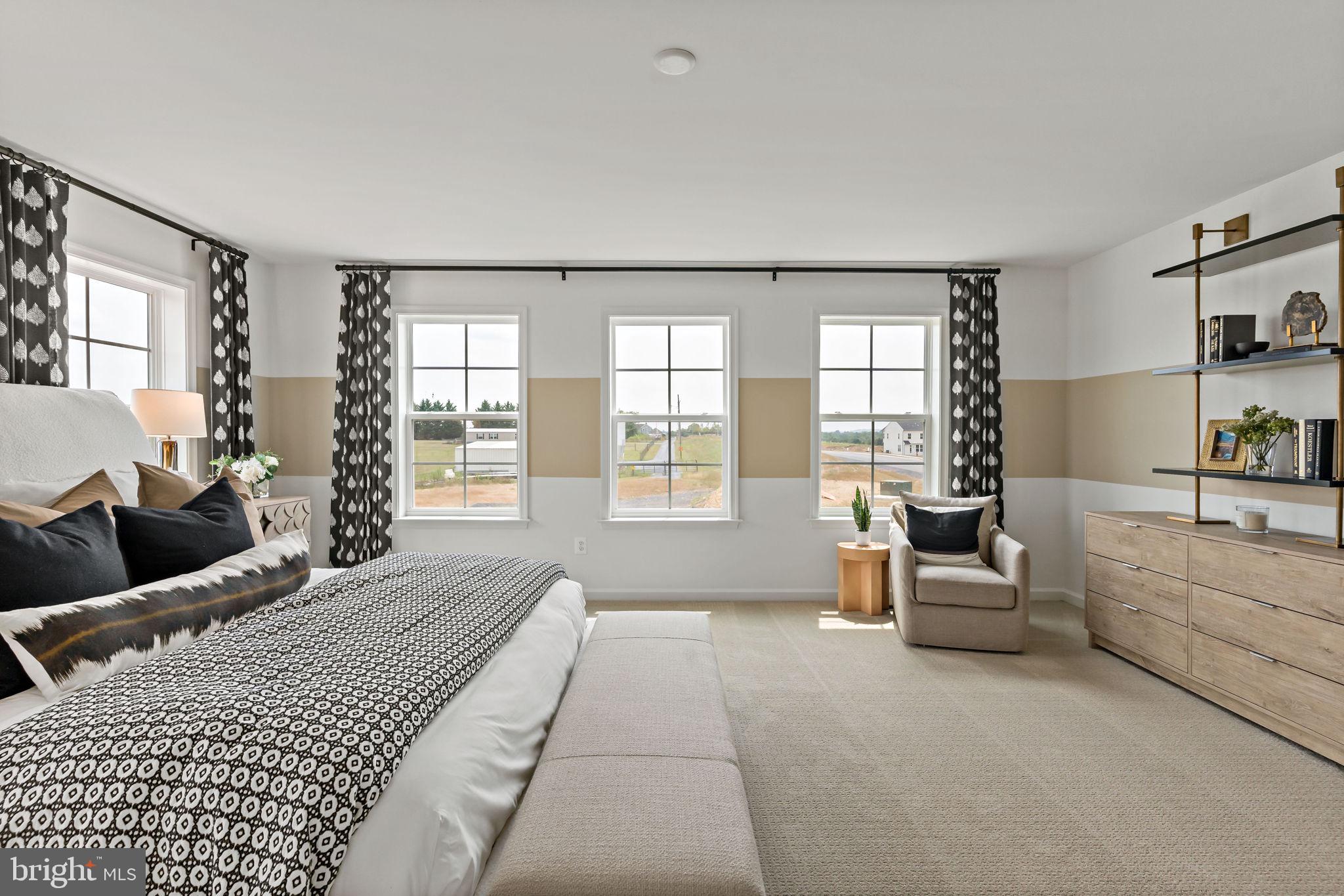 Tbb Tbb Outrigger Road, Unit CARNEGIE Inwood, WV 25428 - Photo 18 of 60 a living room with furniture and large windows