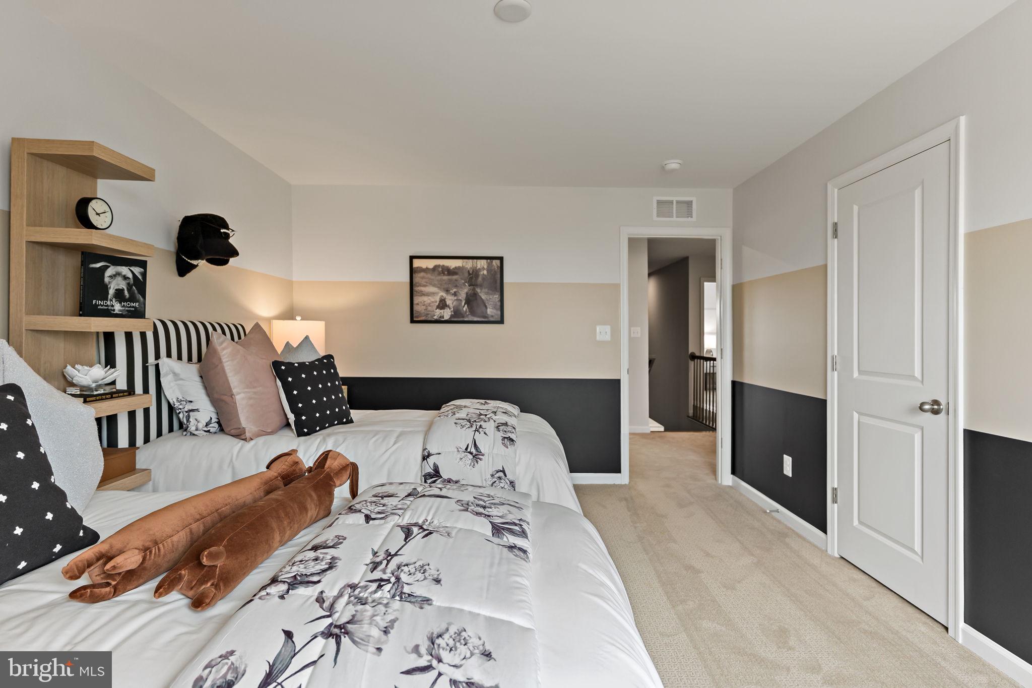 Tbb Tbb Outrigger Road, Unit CARNEGIE Inwood, WV 25428 - Photo 34 of 60 a bedroom with a bed and a walk in closet