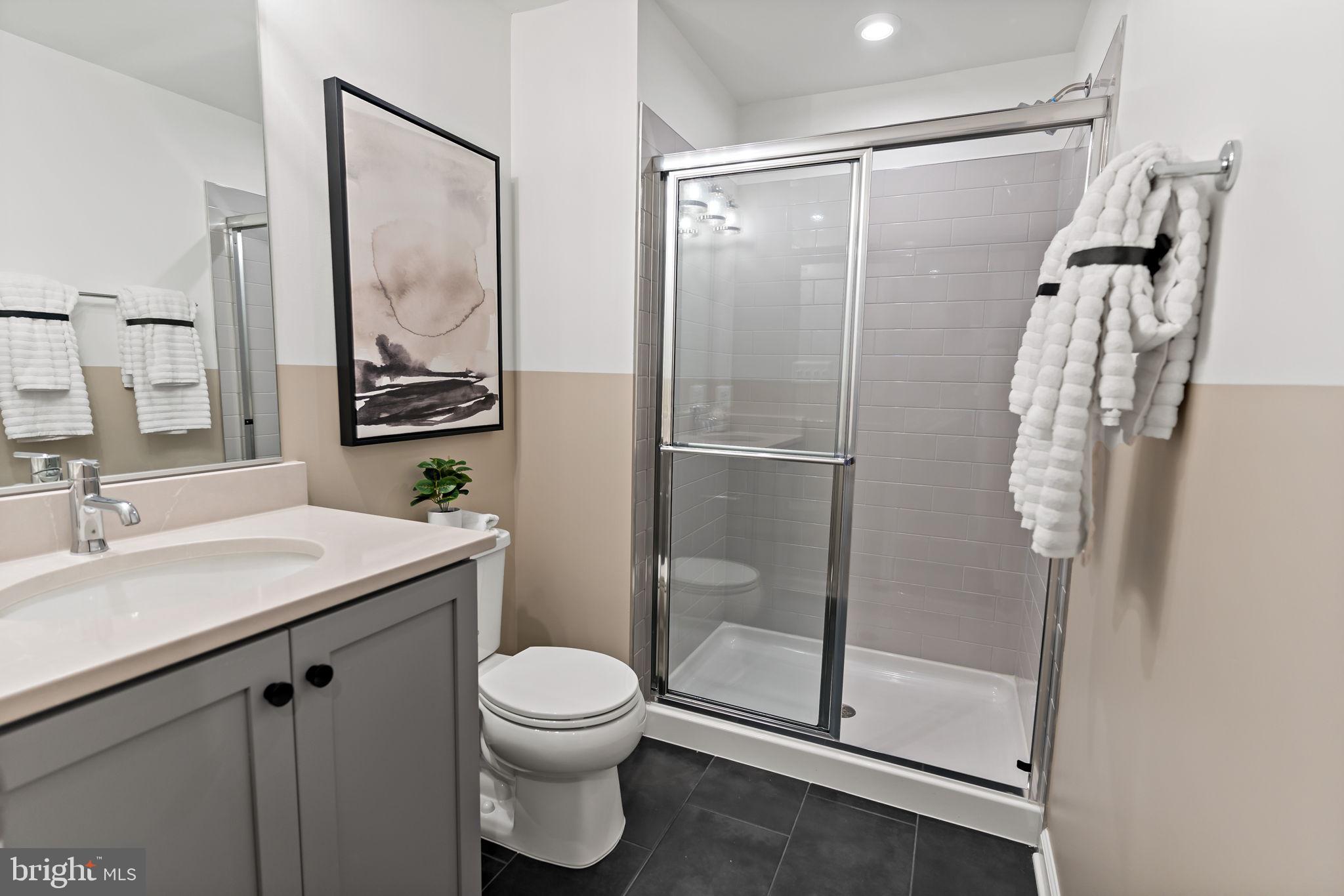 Tbb Tbb Outrigger Road, Unit CARNEGIE Inwood, WV 25428 - Photo 36 of 60 a bathroom with a shower sink vanity mirror and toilet