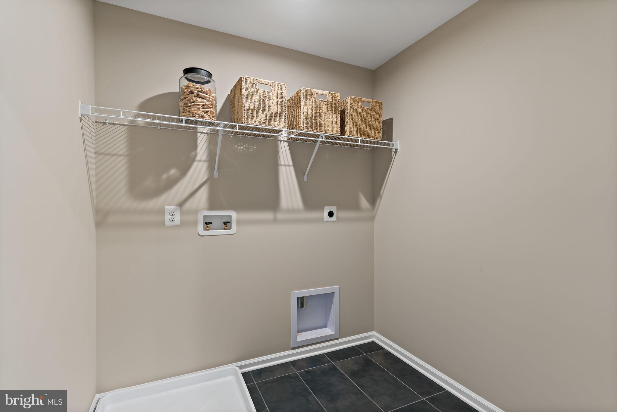 Tbb Tbb Outrigger Road, Unit CARNEGIE Inwood, WV 25428 - Photo 37 of 60 a view of a room with rack on the wall