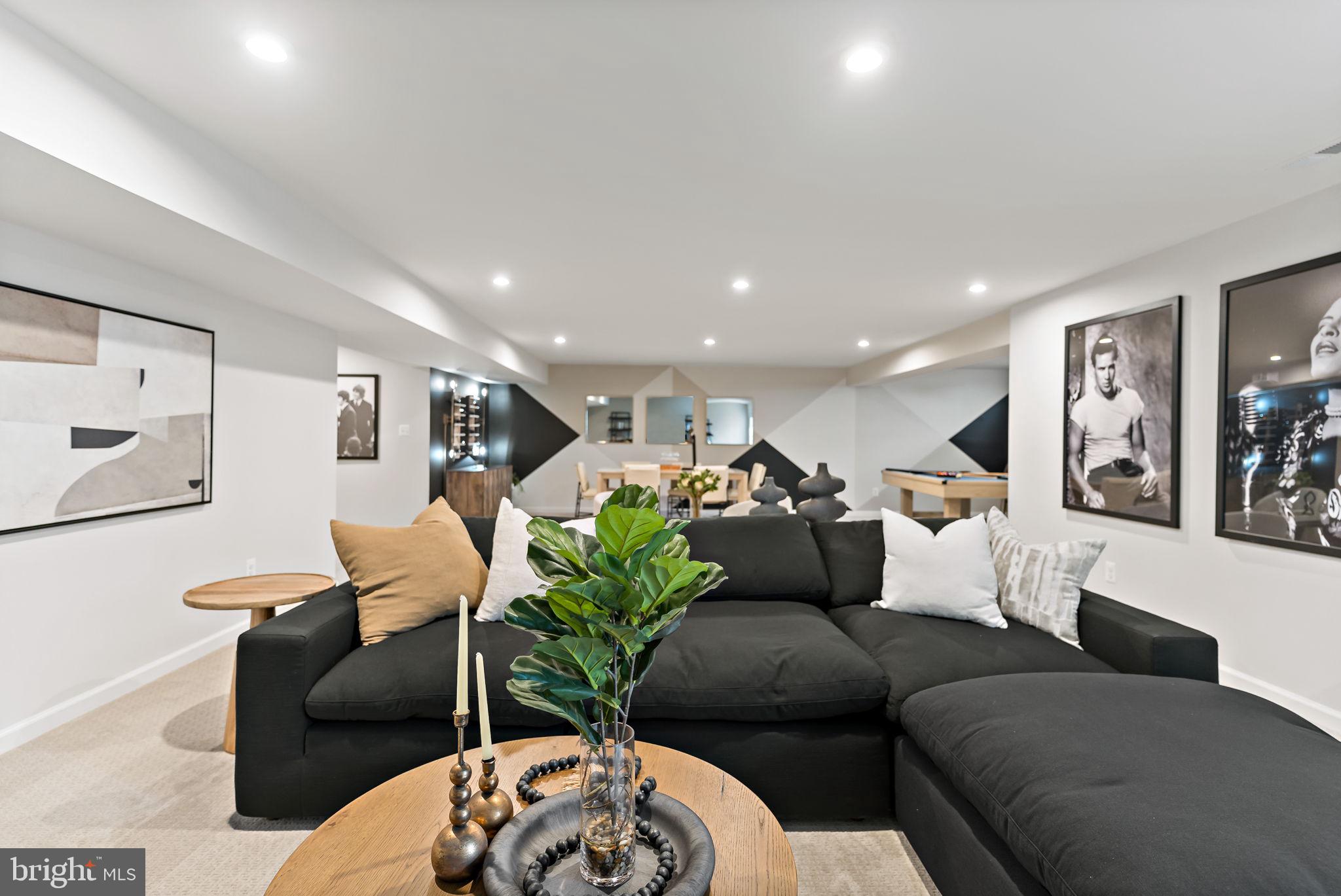 Tbb Tbb Outrigger Road, Unit CARNEGIE Inwood, WV 25428 - Photo 39 of 60 a living room with furniture and wooden floor