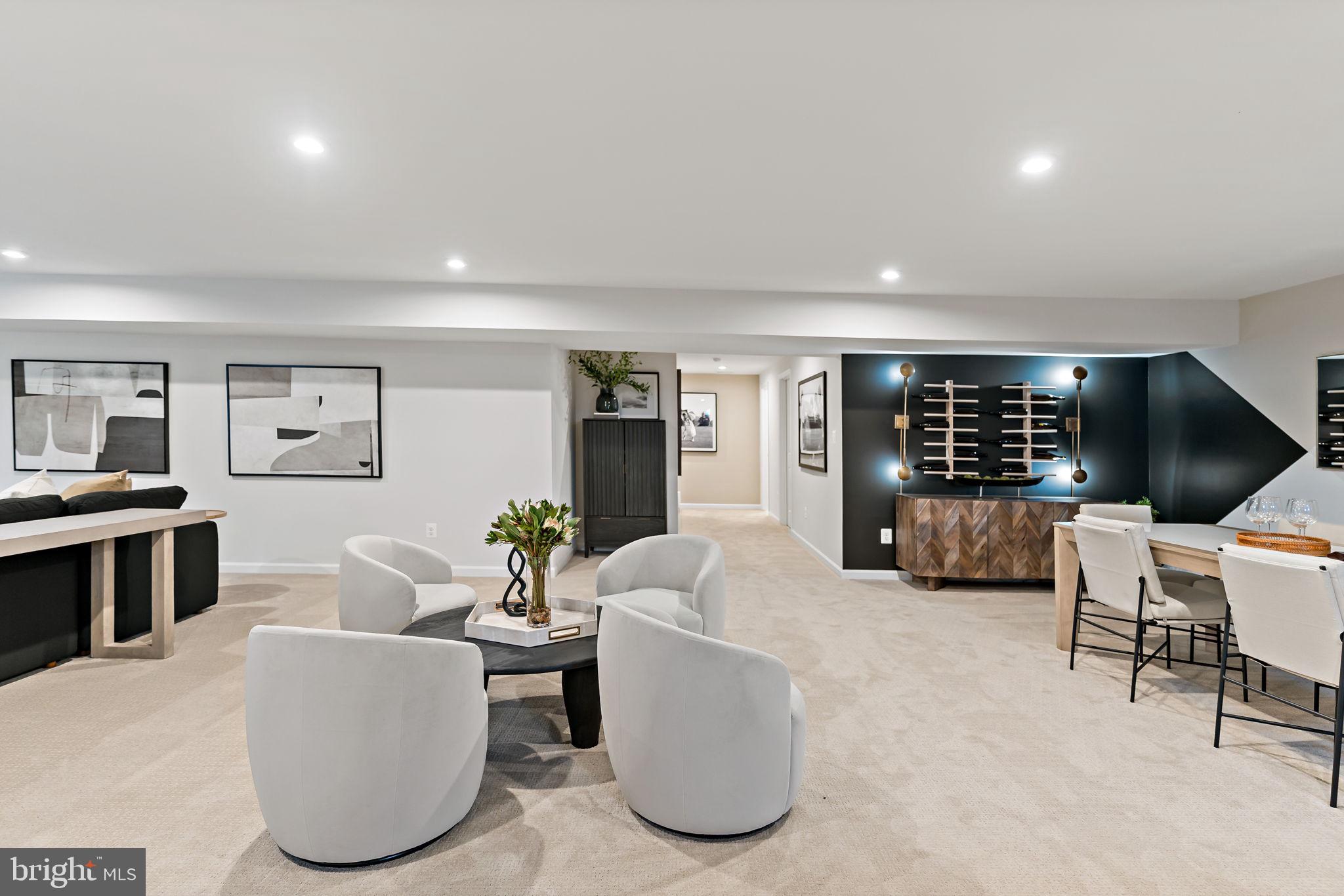 Tbb Tbb Outrigger Road, Unit CARNEGIE Inwood, WV 25428 - Photo 40 of 60 a living room with furniture a table and a bookshelf