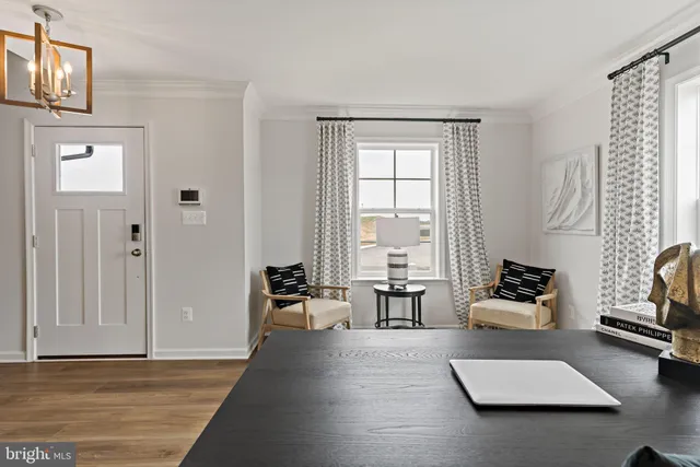 a living room with furniture rug and window