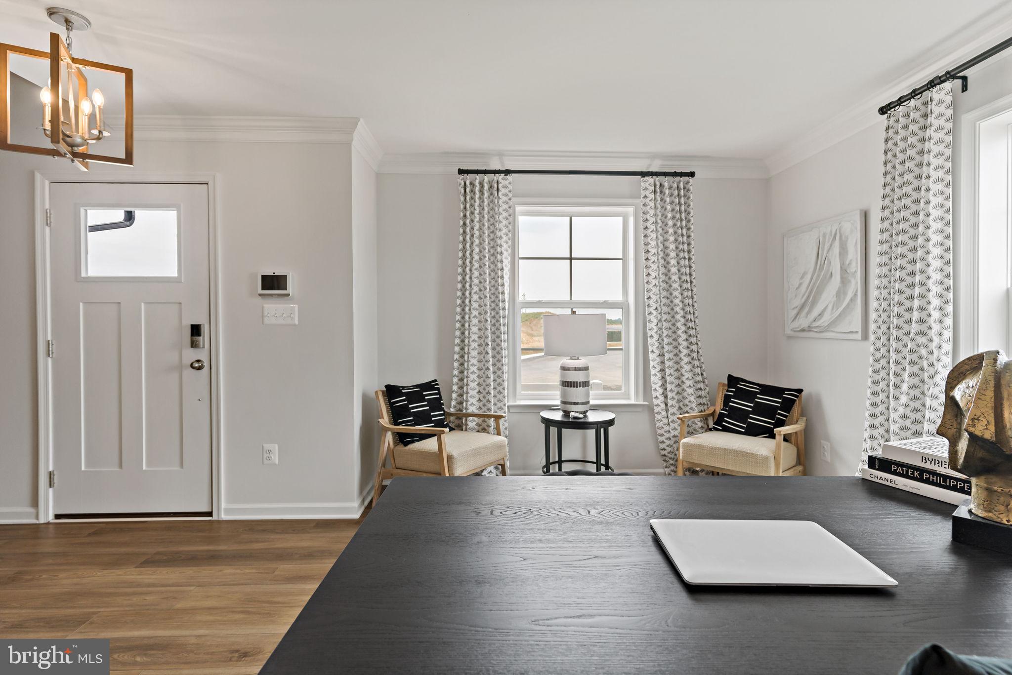 Tbb Tbb Outrigger Road, Unit CARNEGIE Inwood, WV 25428 - Photo 4 of 60 a living room with furniture rug and window
