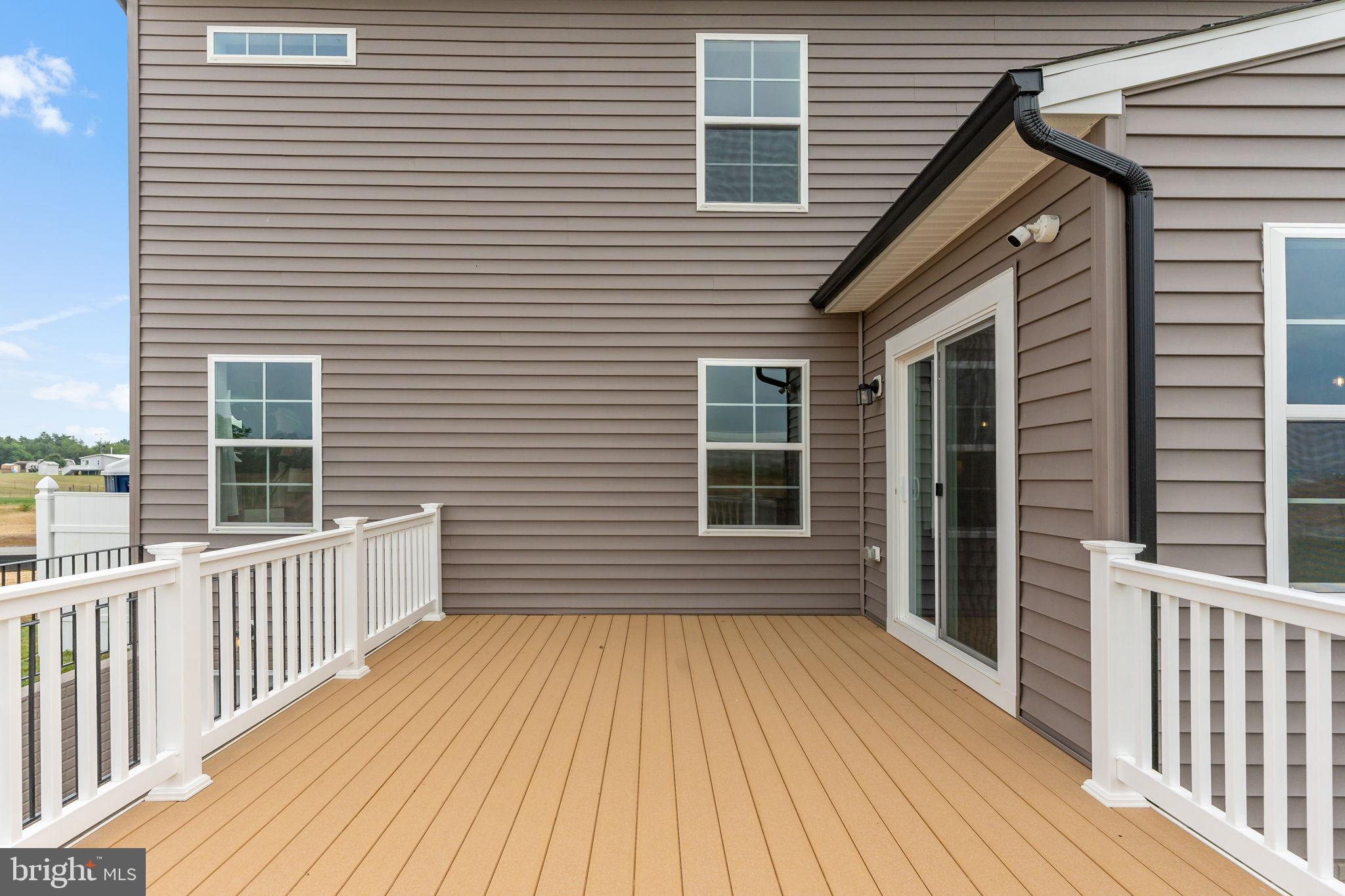 Tbb Tbb Outrigger Road, Unit CARNEGIE Inwood, WV 25428 - Photo 45 of 60 a view of a house with a wooden deck